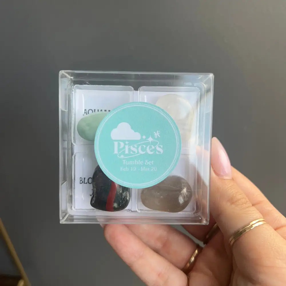 Clear plastic Pisces zodiac box with colorful tumbled stones