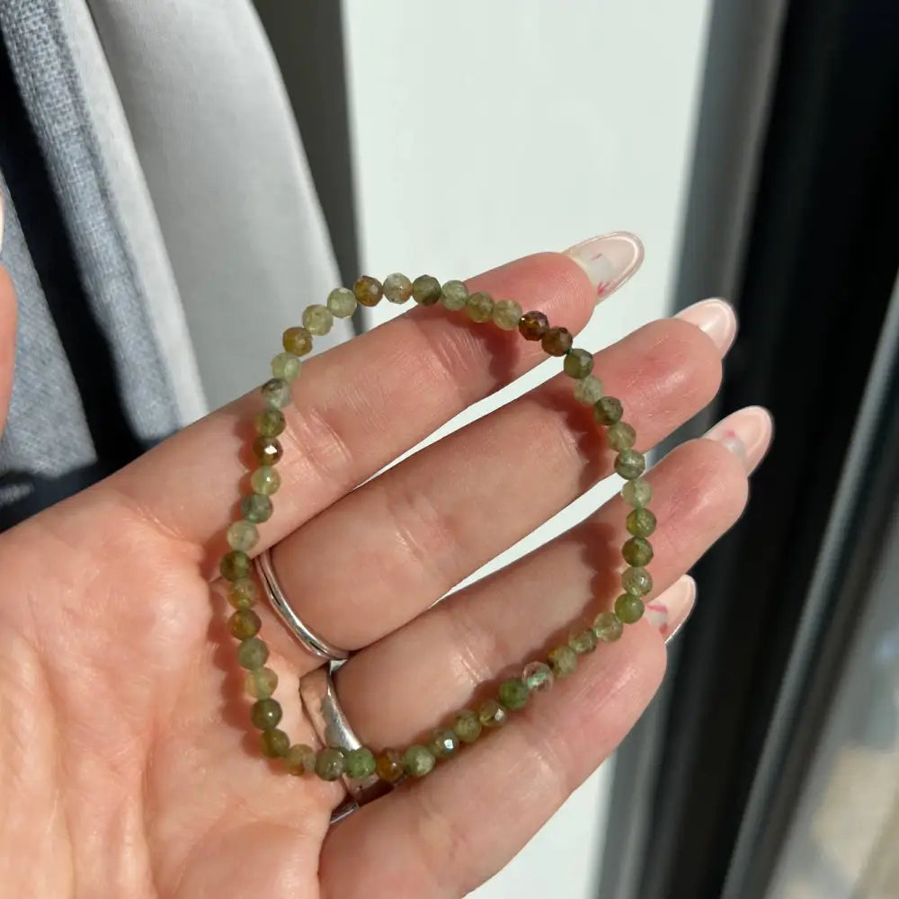 Green Garnet faceted crystal beaded stretch bracelet with silver accents
