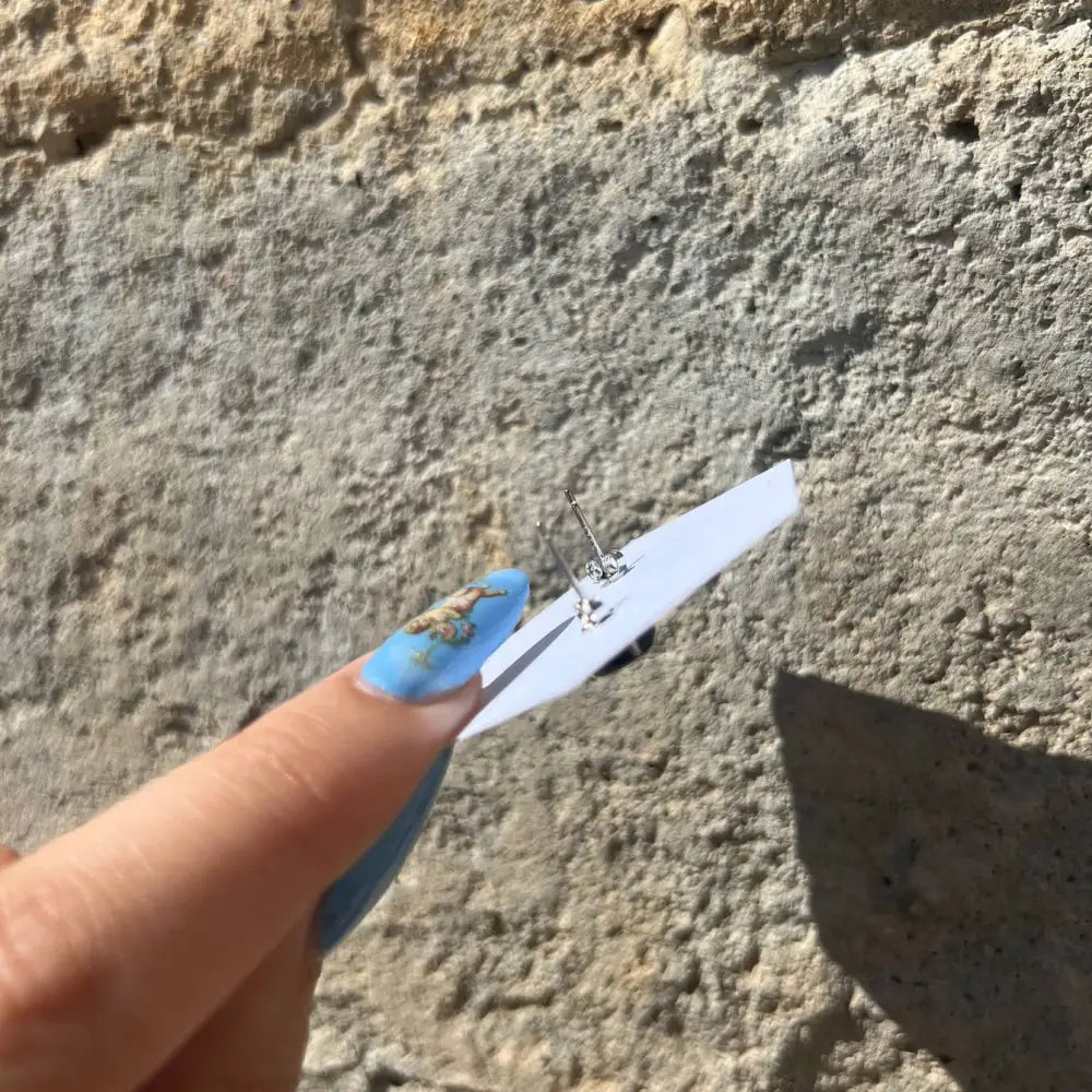 Blue and white floral thumb nail polish on Sterling Silver Hypersthene Gemstone Stud Earrings