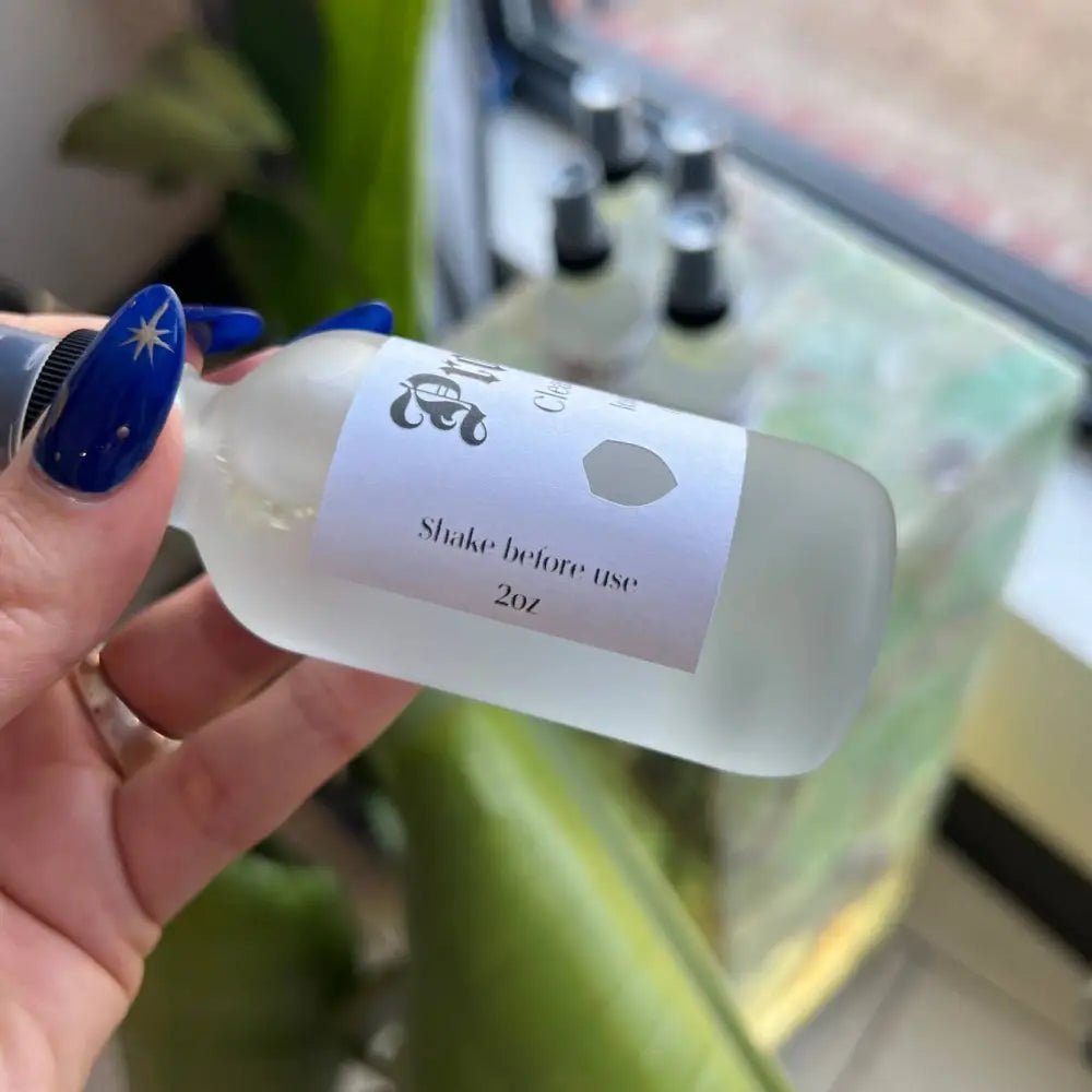 2oz clear glass spray bottle of Protection Cleansing Spray for Home Energy