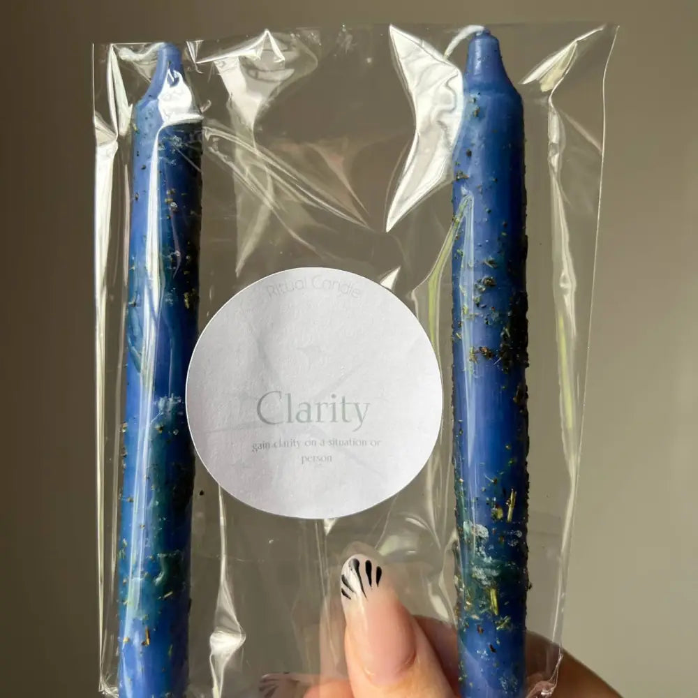 Two blue speckled Clarity Ritual Candles in clear packaging