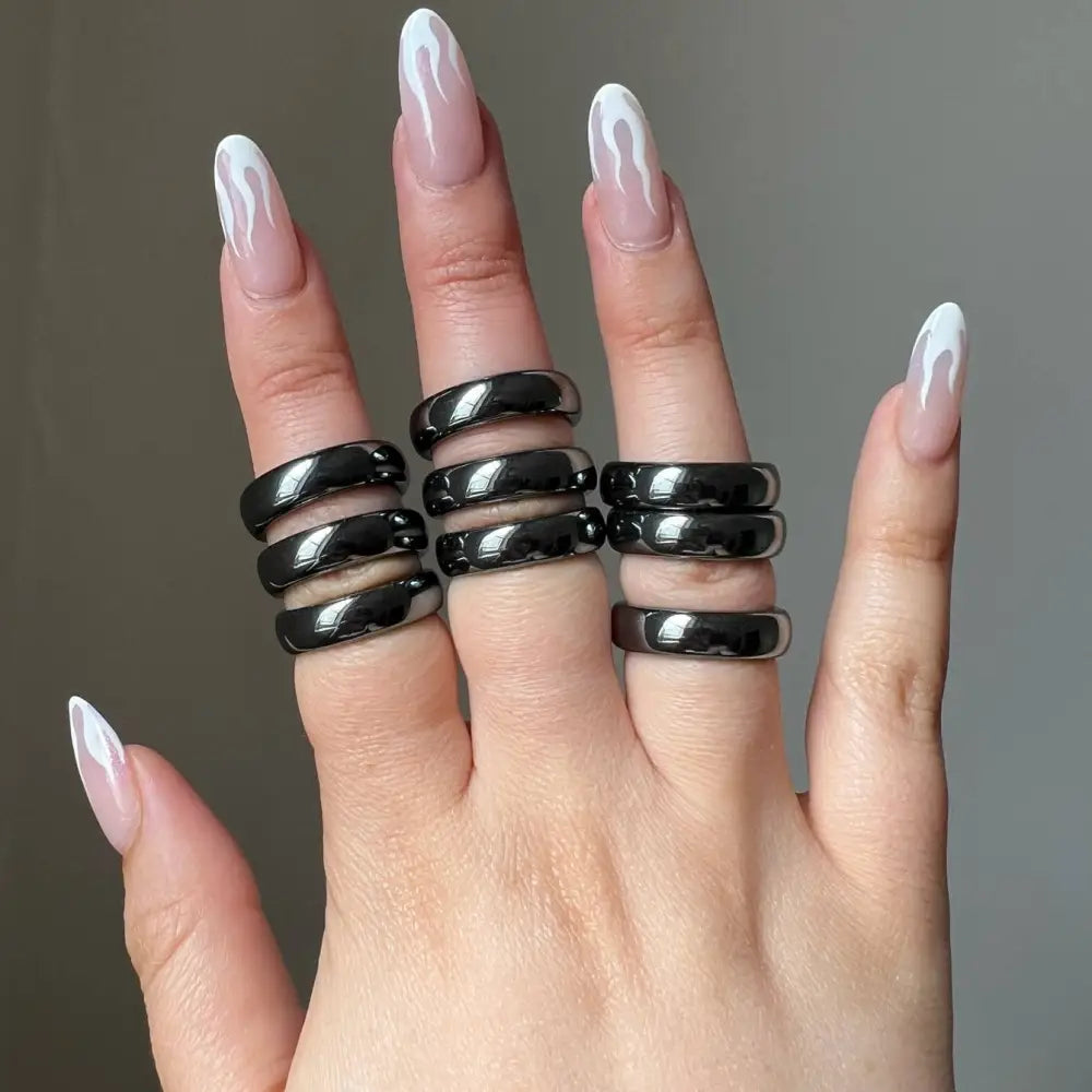 Sleek black glossy natural hematite stone ring with a modern design