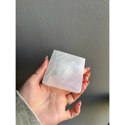 White square soap bar with natural edges in selenite sphere holder