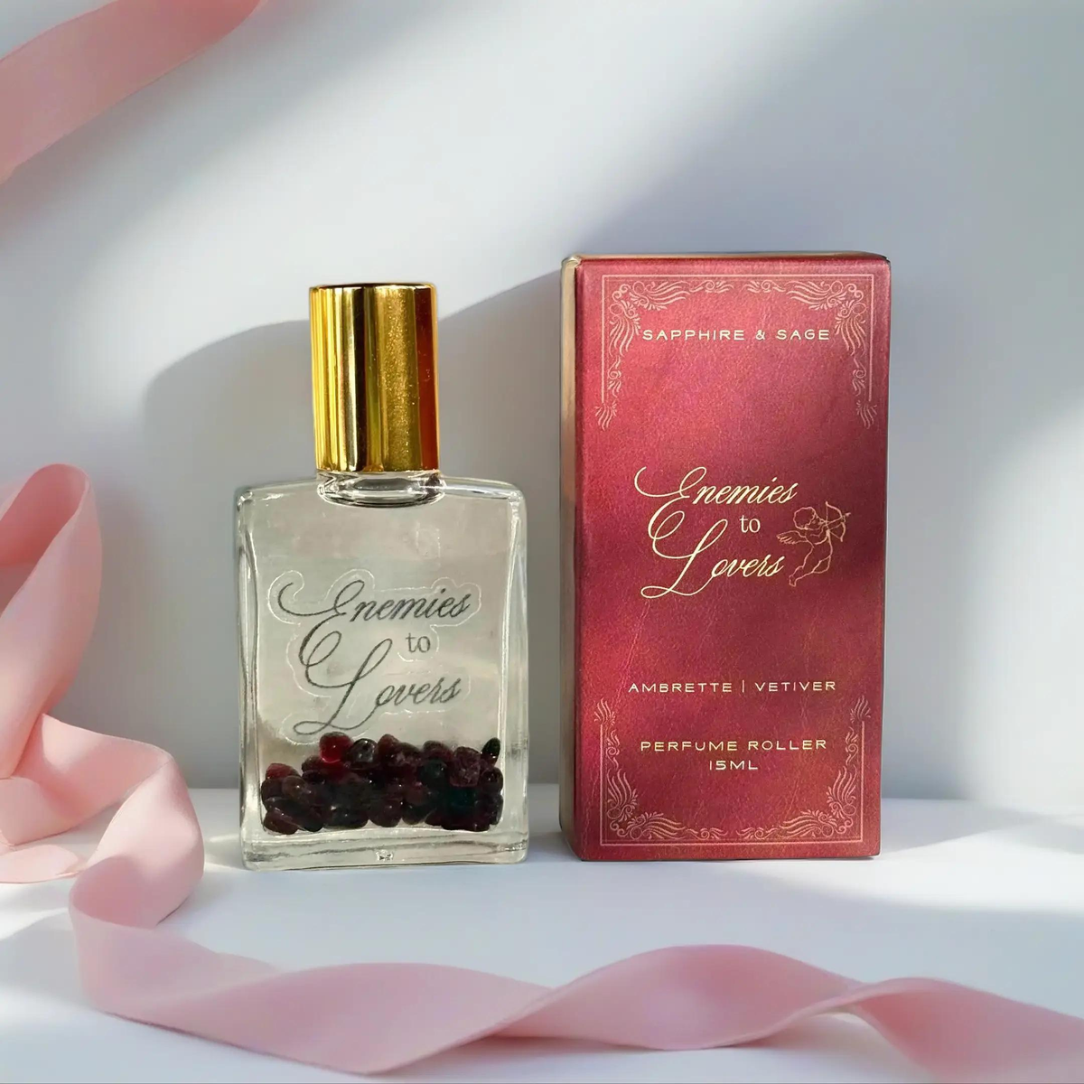 Enemies to Lovers crystal-infused perfume roller with garnet chips, 15ml amber glass rollerball