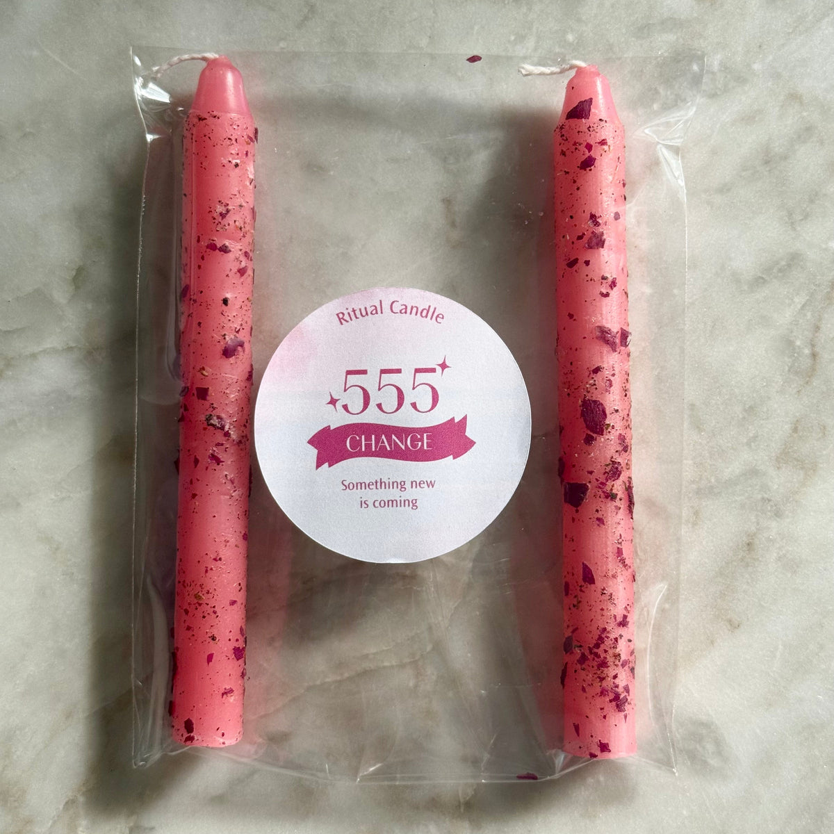 555 Change pink ritual candle pair with red flecks