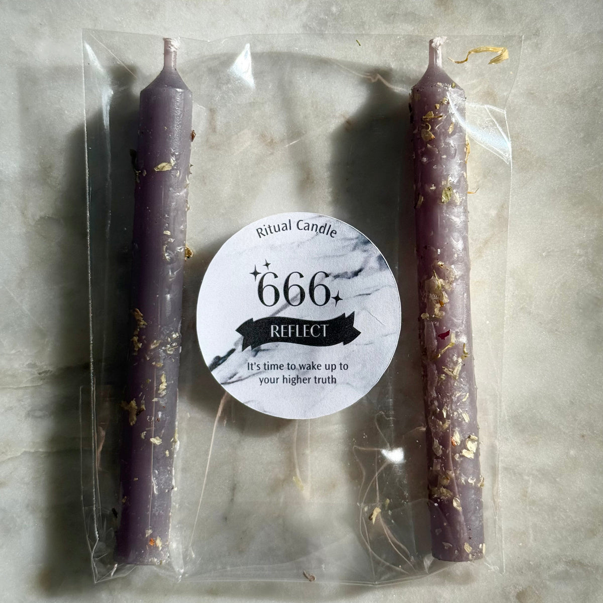 666 Reflect dusty purple ritual candle pair with herb inclusions