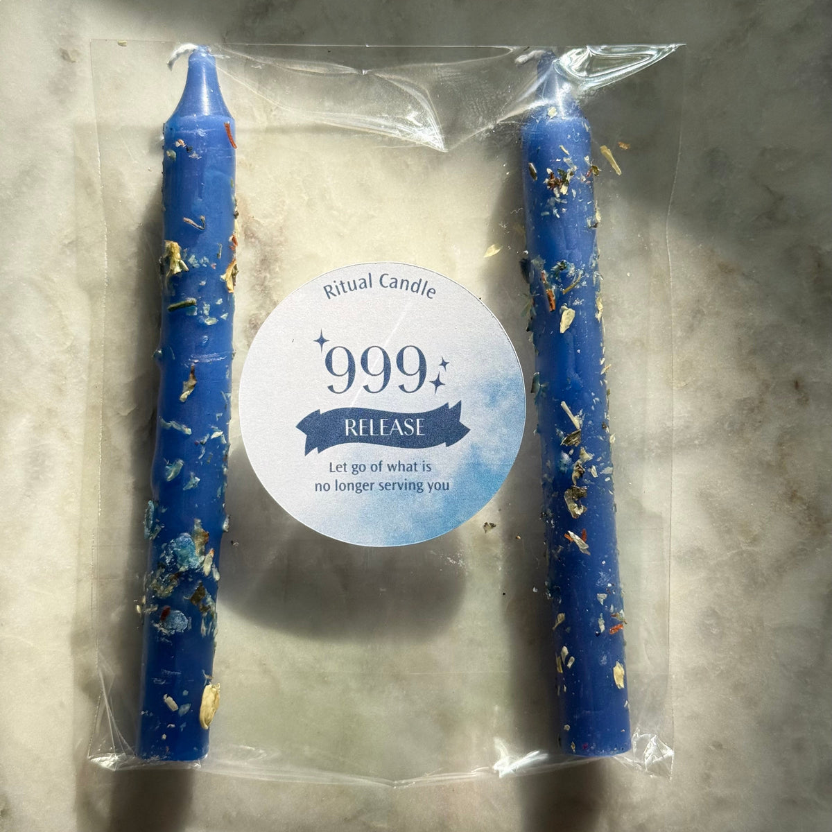 999 Release navy ritual candle pair with herb inclusions