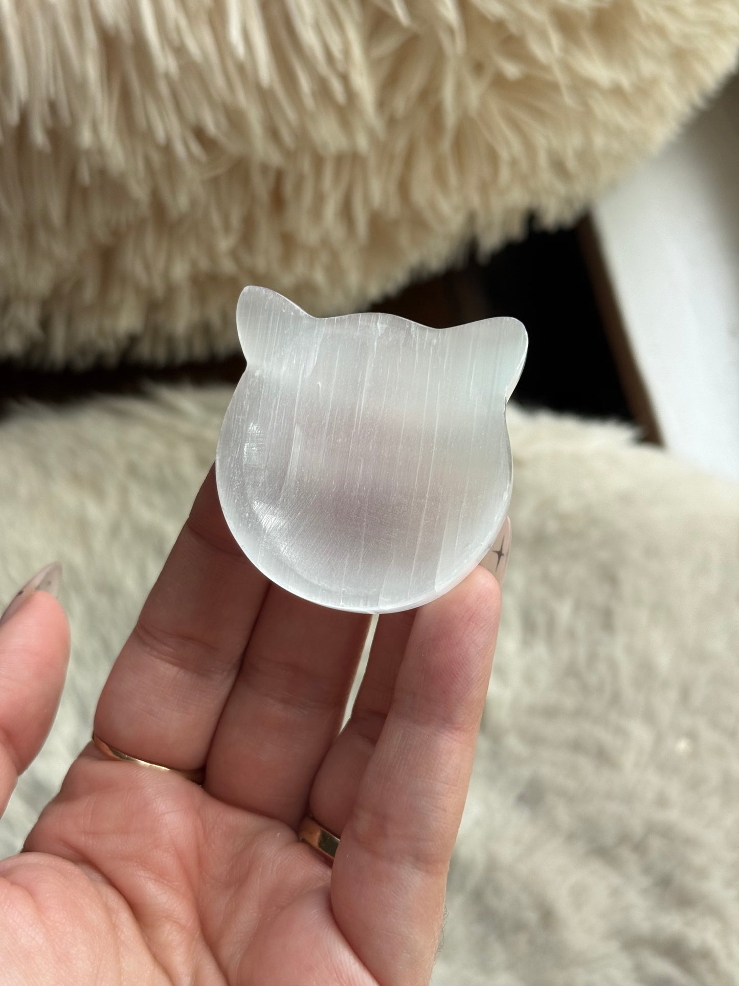 Selenite cat bowl on a soft fur background