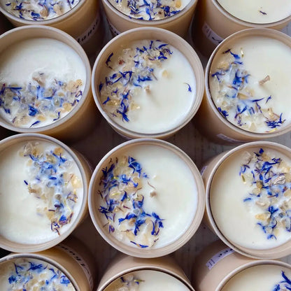 10 oz lavender soy candle in glass jar with blue petals