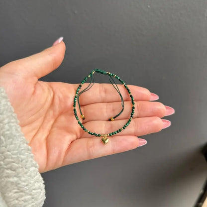 Green adjustable crystal gemstone bracelet with gold heart charm