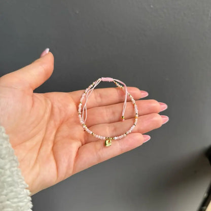 Pink adjustable crystal gemstone bracelet with gold heart charm