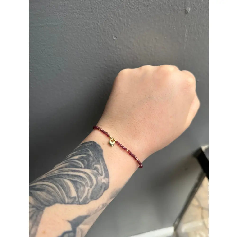 Red adjustable crystal gemstone bracelet with gold heart charm