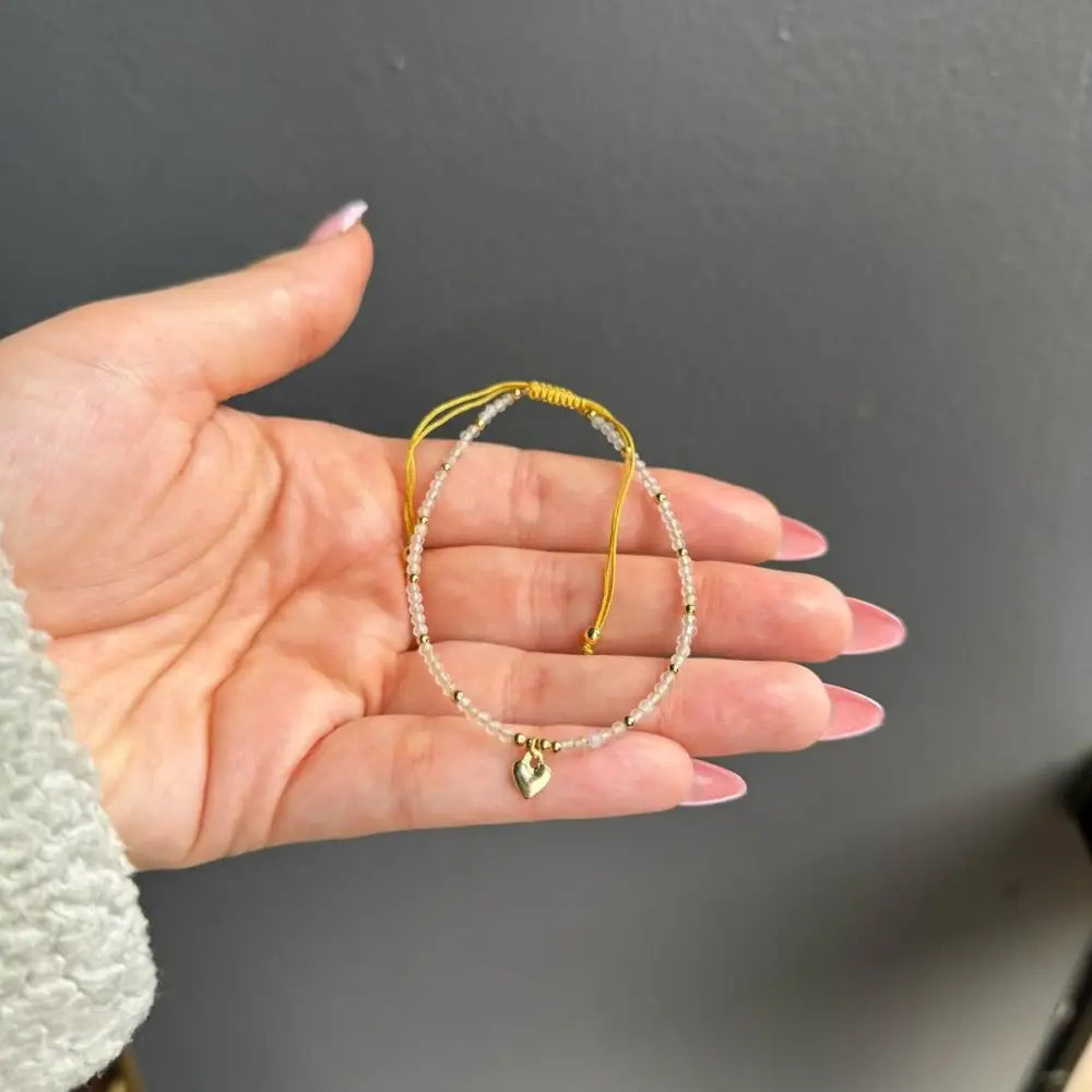 Gold and white beaded adjustable crystal gemstone bracelet with heart charm
