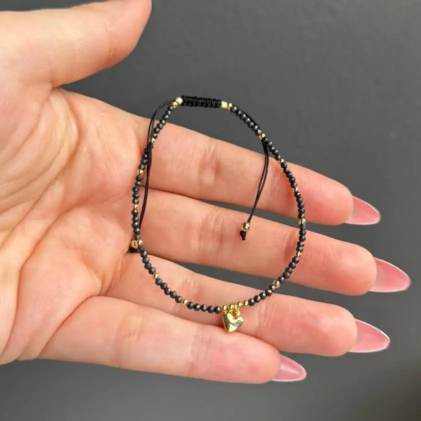 Black and gold beaded adjustable crystal gemstone bracelet with heart charm