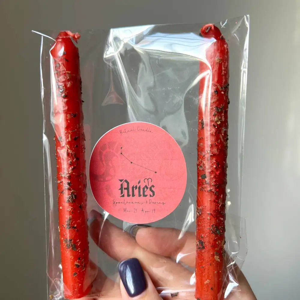 Red tasseled Aries zodiac ritual candles in clear pack, double set
