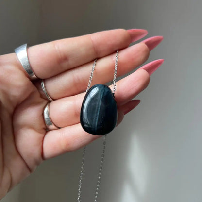 Black onyx pendant necklace with silver chain for focus and strength