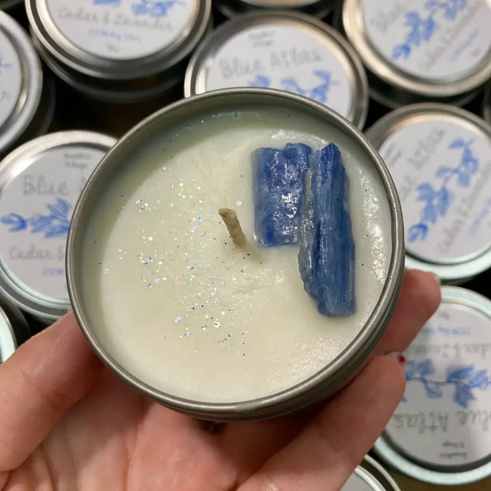 Blue Atlas 4oz soy wax candle tin with kyanite crystals and glitter