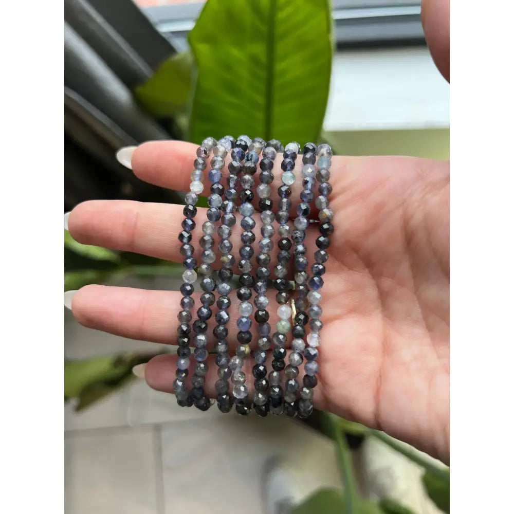 Vibrant multi-colored 4mm faceted bead bracelet set in gray, white, black