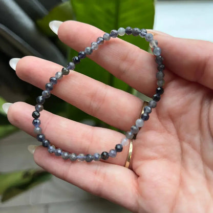 4mm faceted bead bracelet with blue and black stone beads