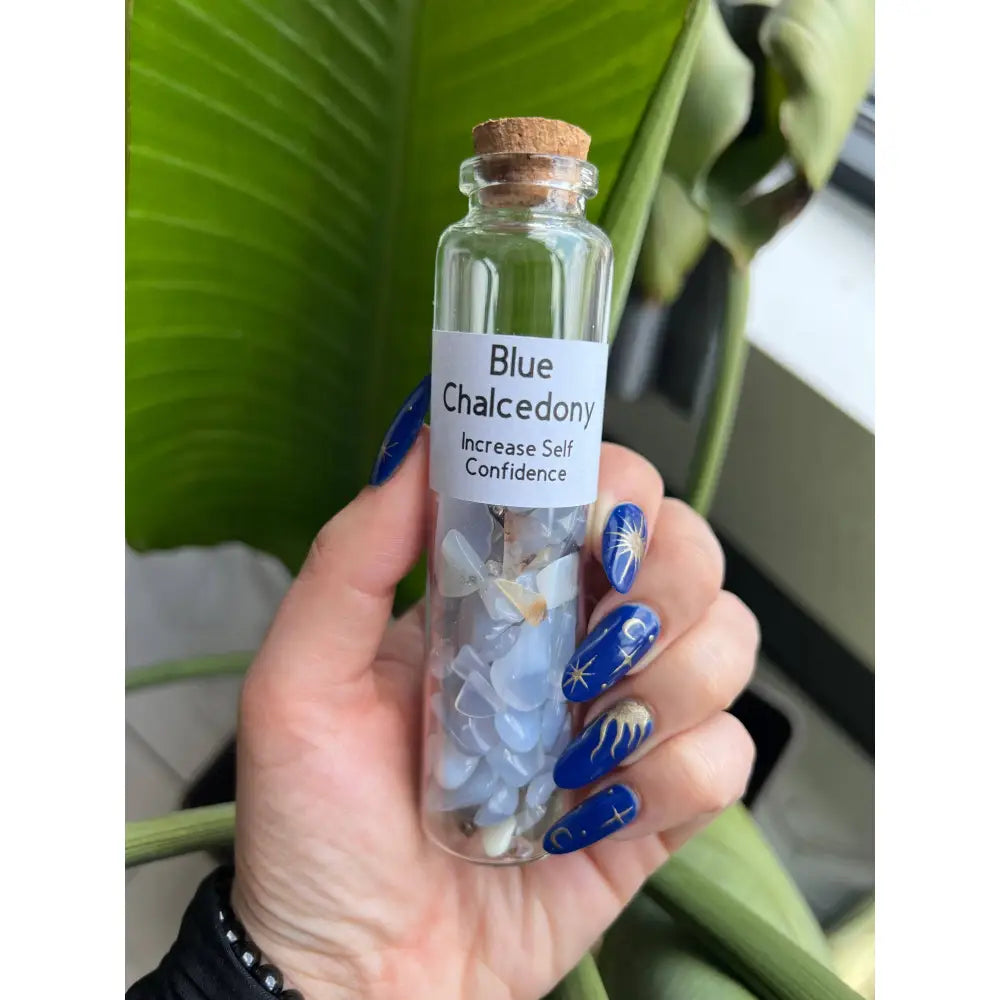 Blue chalcedony chips in 5-inch glass jar with cork and label