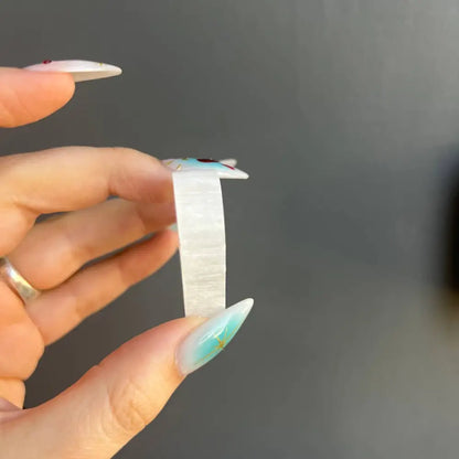 White butterfly nail stickers with blue accents on clear wings