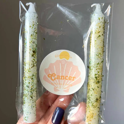 White and green speckled Cancer zodiac ritual candles in clear pack with herbs and oils