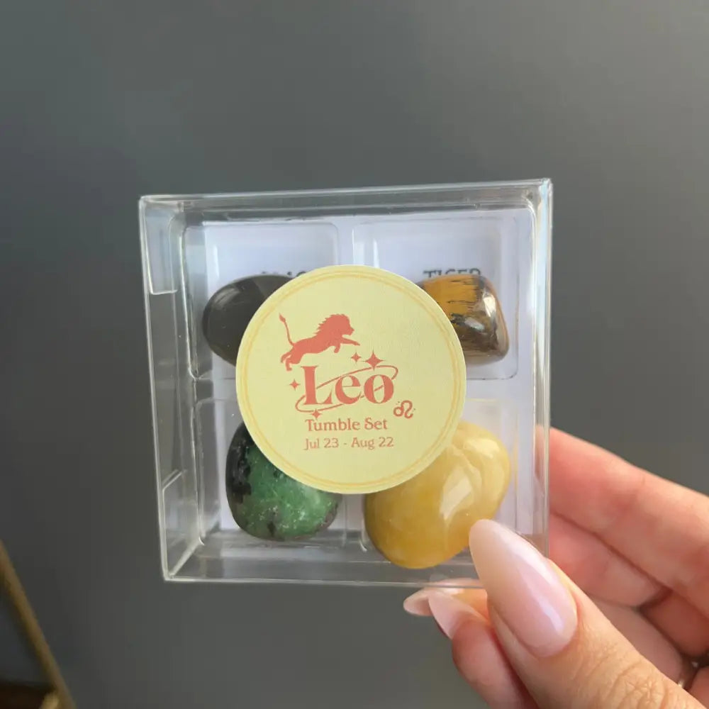 Leo Zodiac tumbled crystal set in clear acrylic box with colorful gemstones and yellow label