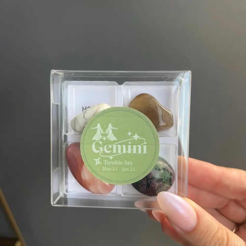 Clear acrylic gemstone box with green Gemini label and starry trees design