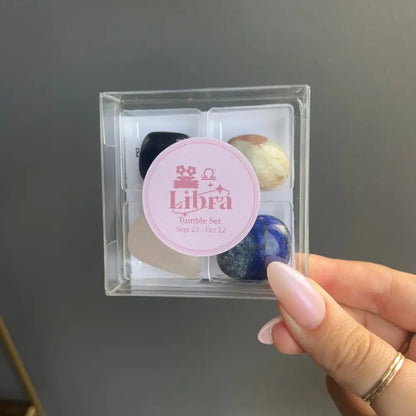 Libra tumble box with colorful marbles in clear plastic packaging
