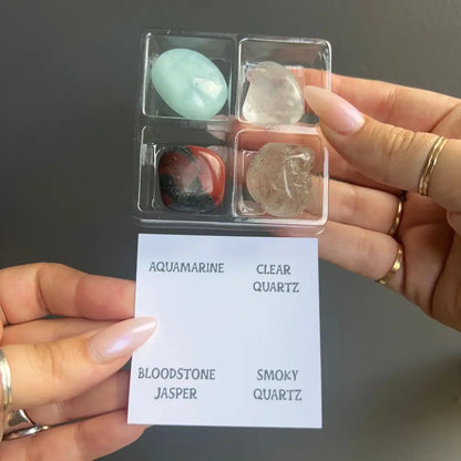 Aquamarine and clear quartz tumbled crystals in Zodiac set, labeled plastic case