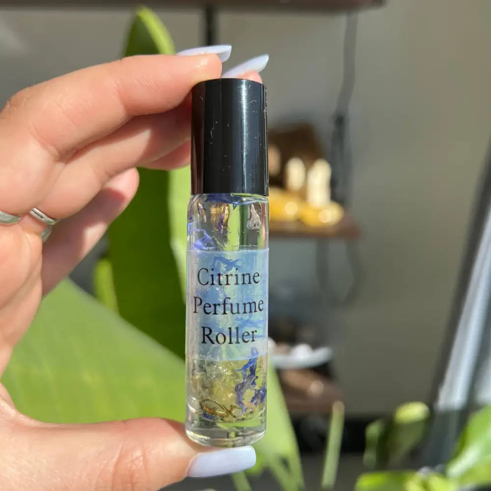 Ambrette Poppy Fig 10ml perfume roller with citrine floral contents and black cap