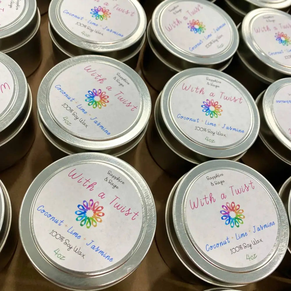 4oz silver tin candle with colorful flowers and With a Twist branding