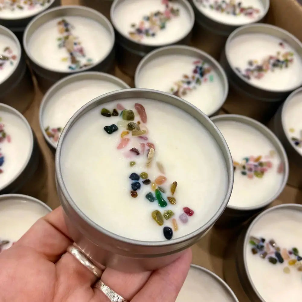 4oz tin candle with white wax, colorful gemstones, and silver lid for small spaces