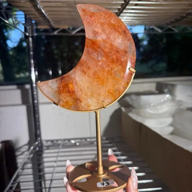 Moon-shaped agate on gold stand, Fire Quartz Crescent Moon figurine