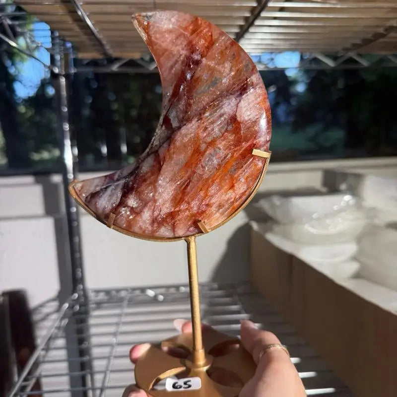 Fire Quartz crescent moon agate on brass stand with brown red hues