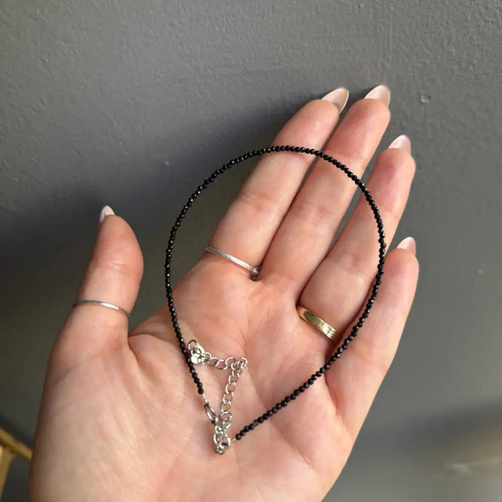 Black beaded choker with silver clasp, chain, and 3mm crystals