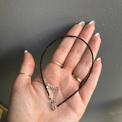 Black beaded choker with silver clasp, chain, and 3mm crystals