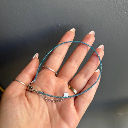 Blue beaded anklet with silver chain and skull charm for women