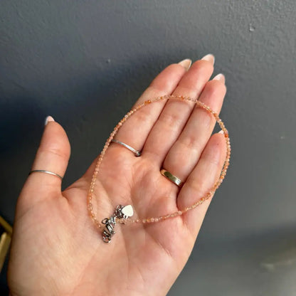 Peach beaded anklet with silver heart charm for women