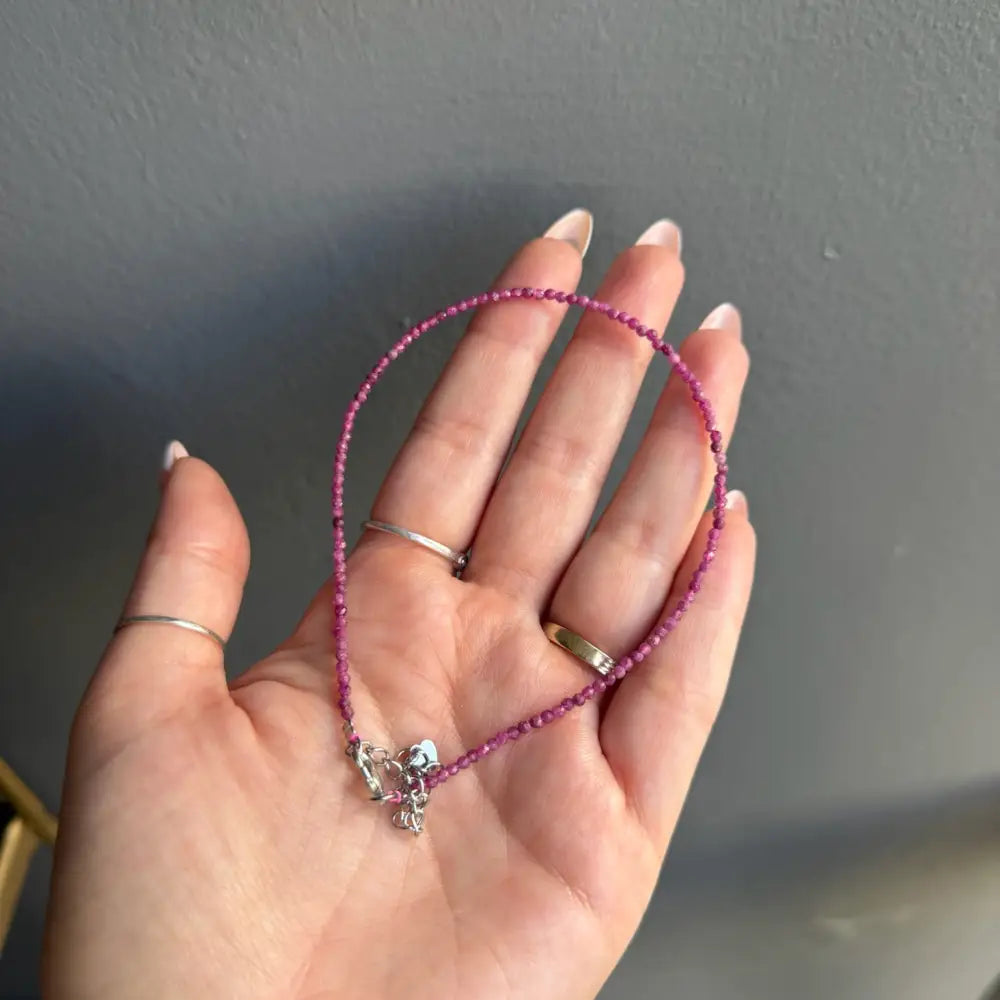 Pink 3mm crystal bead anklet for women with silver skull charm and gold accents