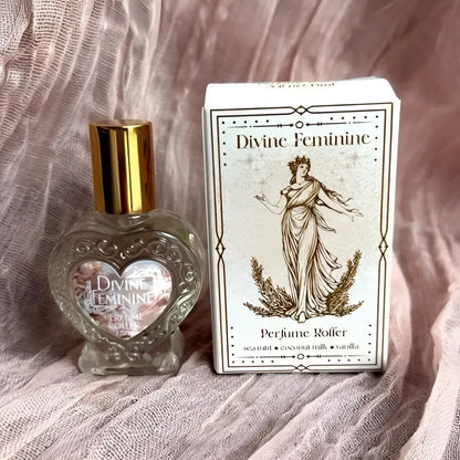Divine feminine crystal-infused rollerball perfume with heart-shaped glass bottle and gold cap