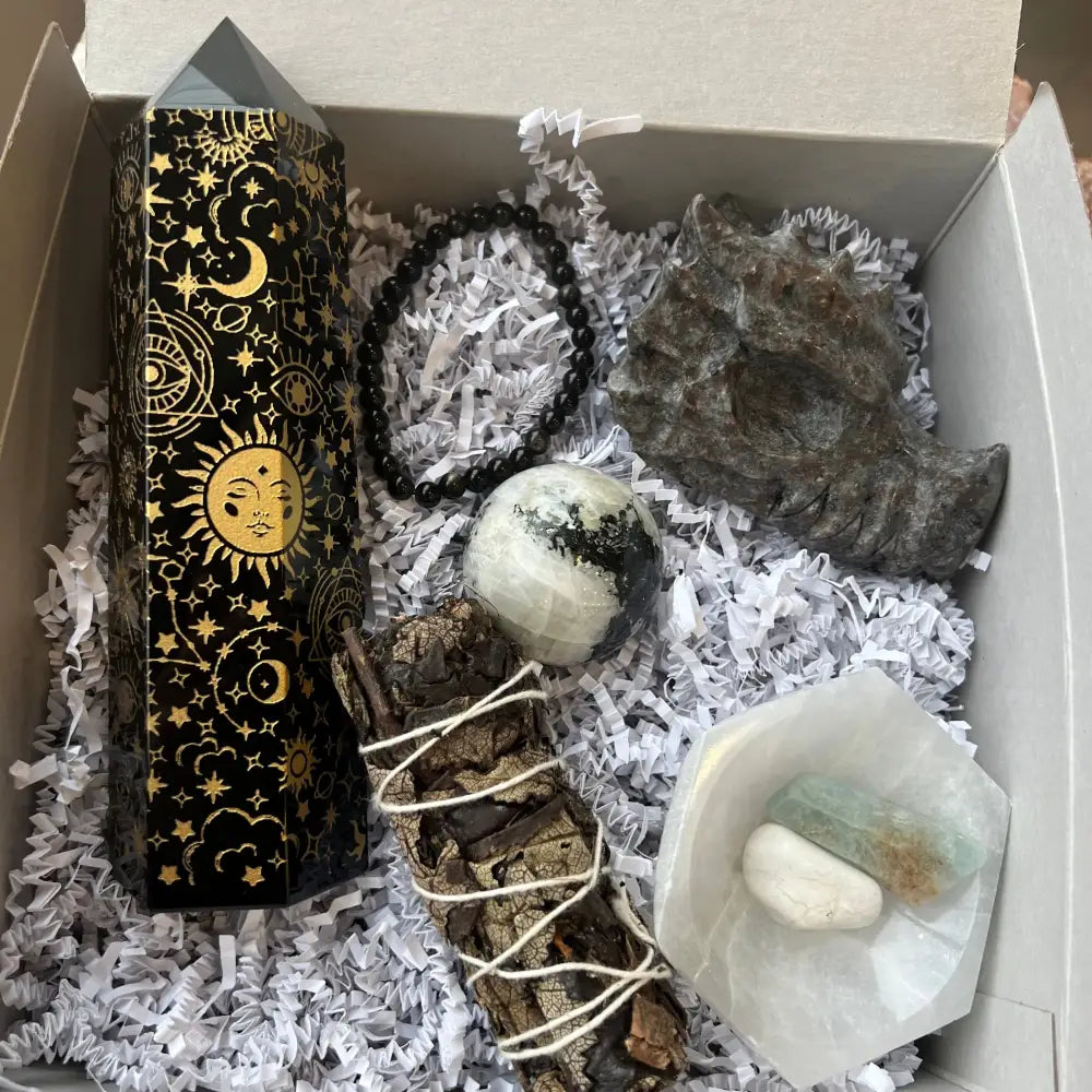 Black and gold tarot box with celestial symbols in Crystal Intuition Box