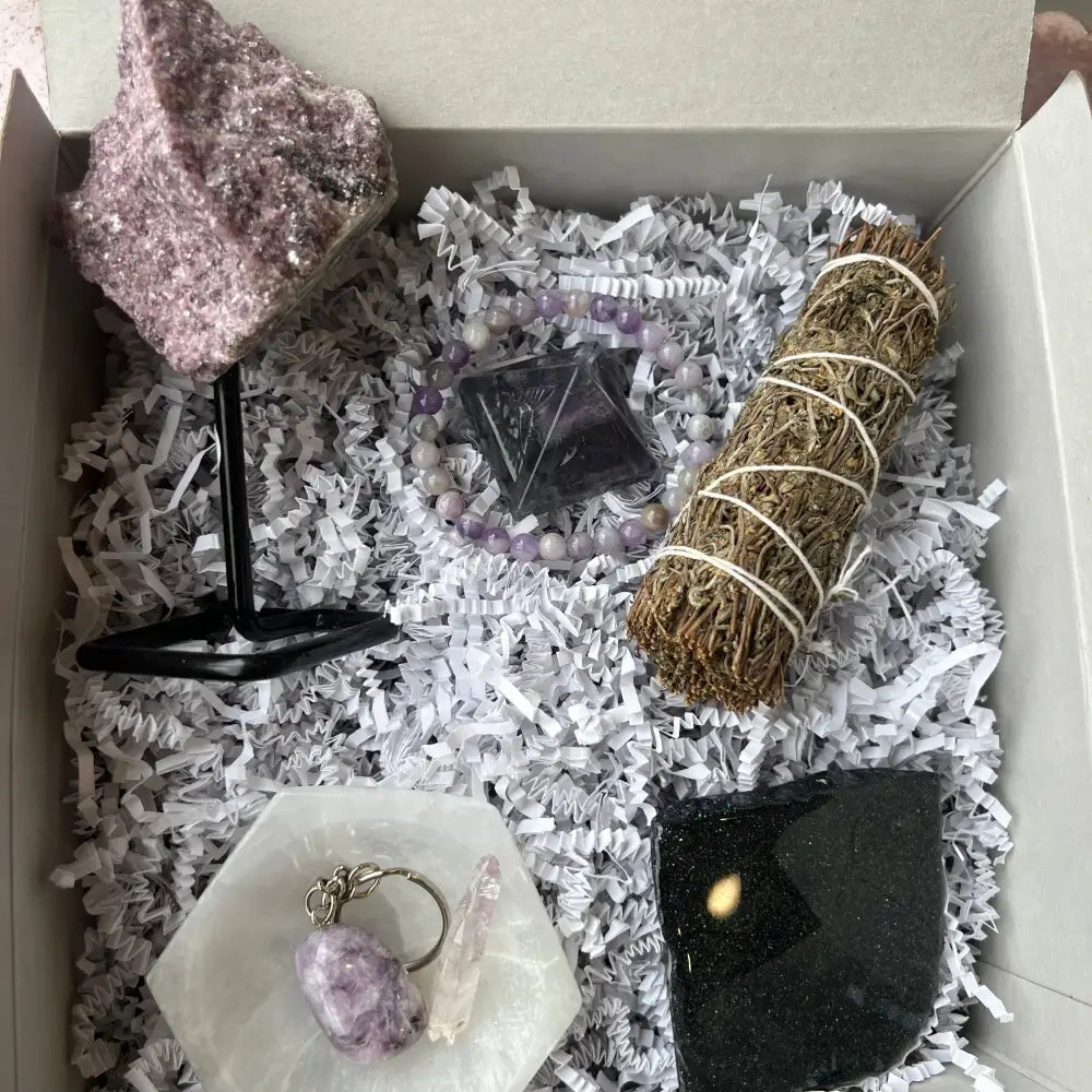 Pink salt crystal rock on black stand in Crystal Intuition Box