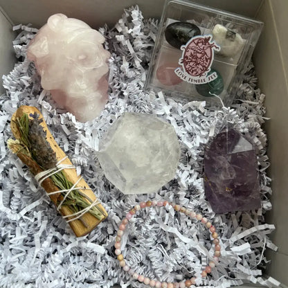 Rose quartz skull healing kit with smudge stick and gemstone bracelet in Crystal Intuition Box