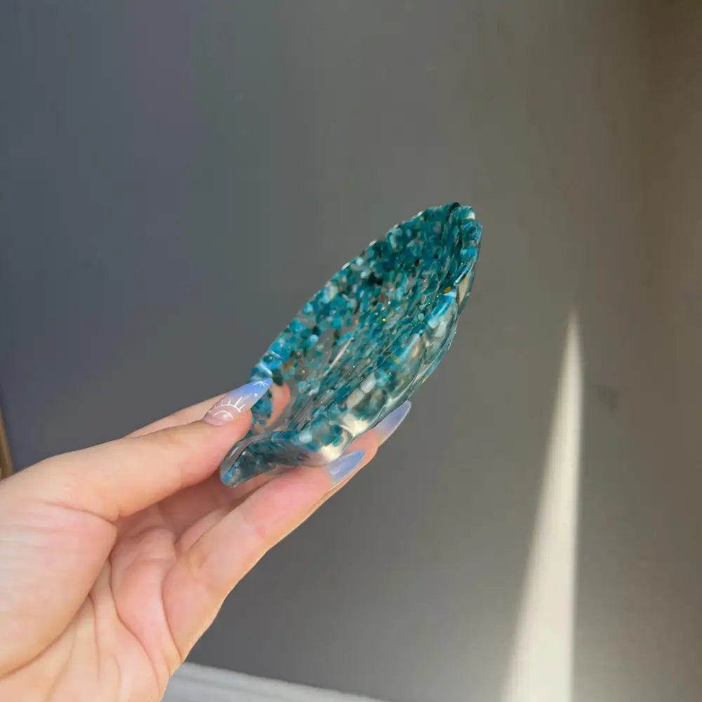 Blue crystal point with green speckles in Crystal Seashell Resin Bowl