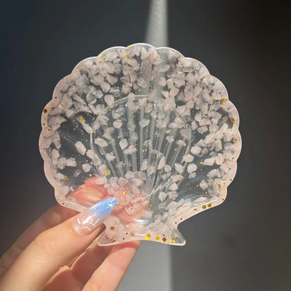 Clear scallop shell trinket dish with pink white stones and gold glitter
