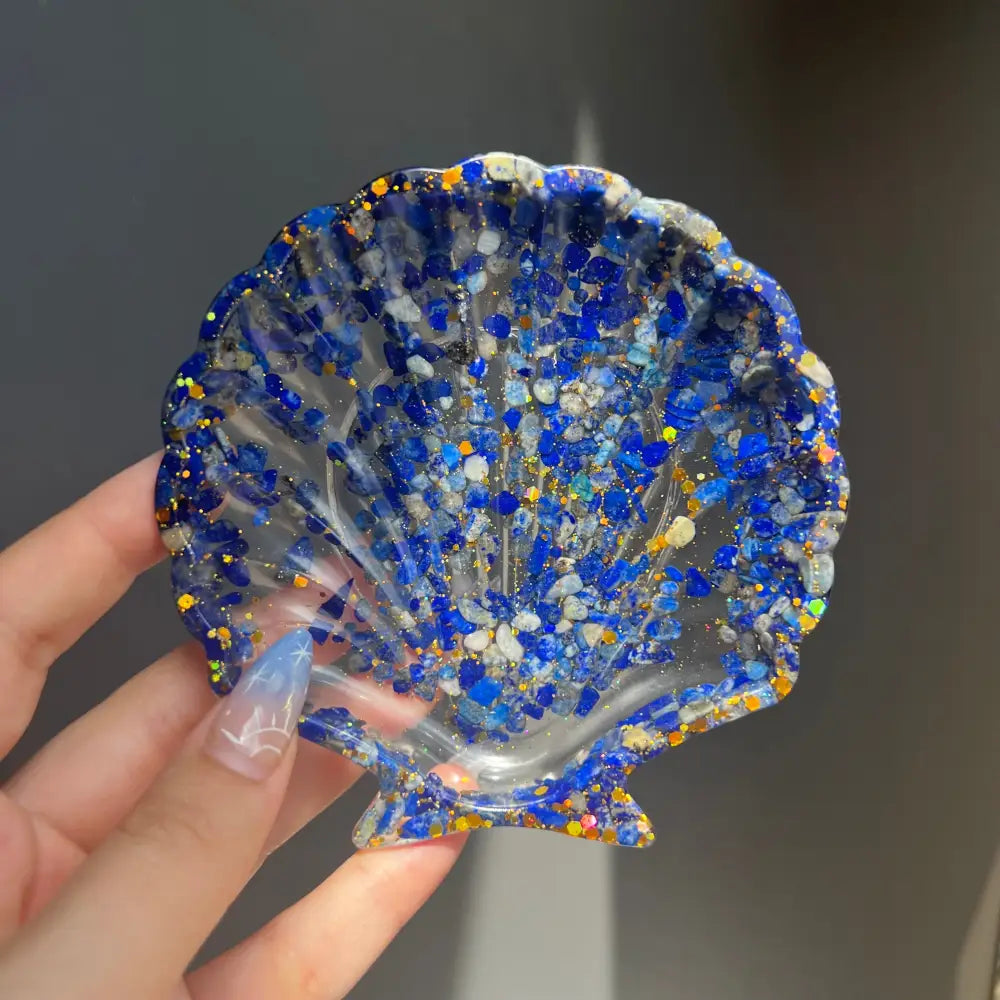 Blue resin scallop shell dish with glitter and crystals