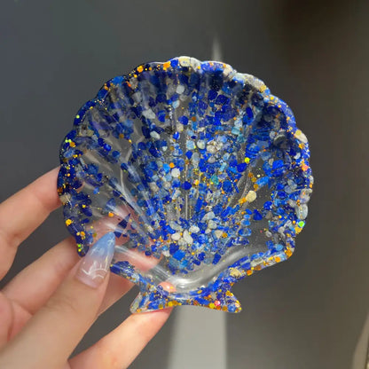 Blue resin scallop shell dish with glitter and crystals