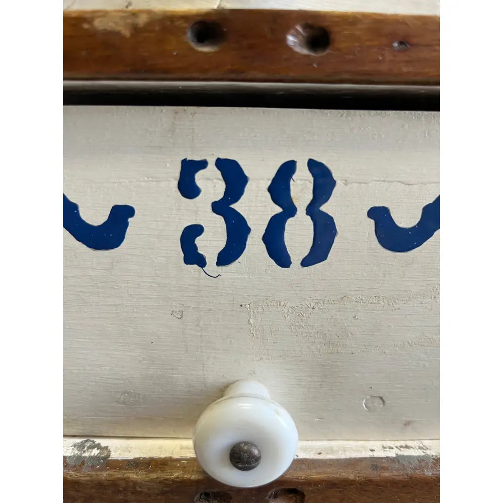 38 drawer handle with white plastic knob and blue 38 number in Mystery Crystal Box from Apothecary Case
