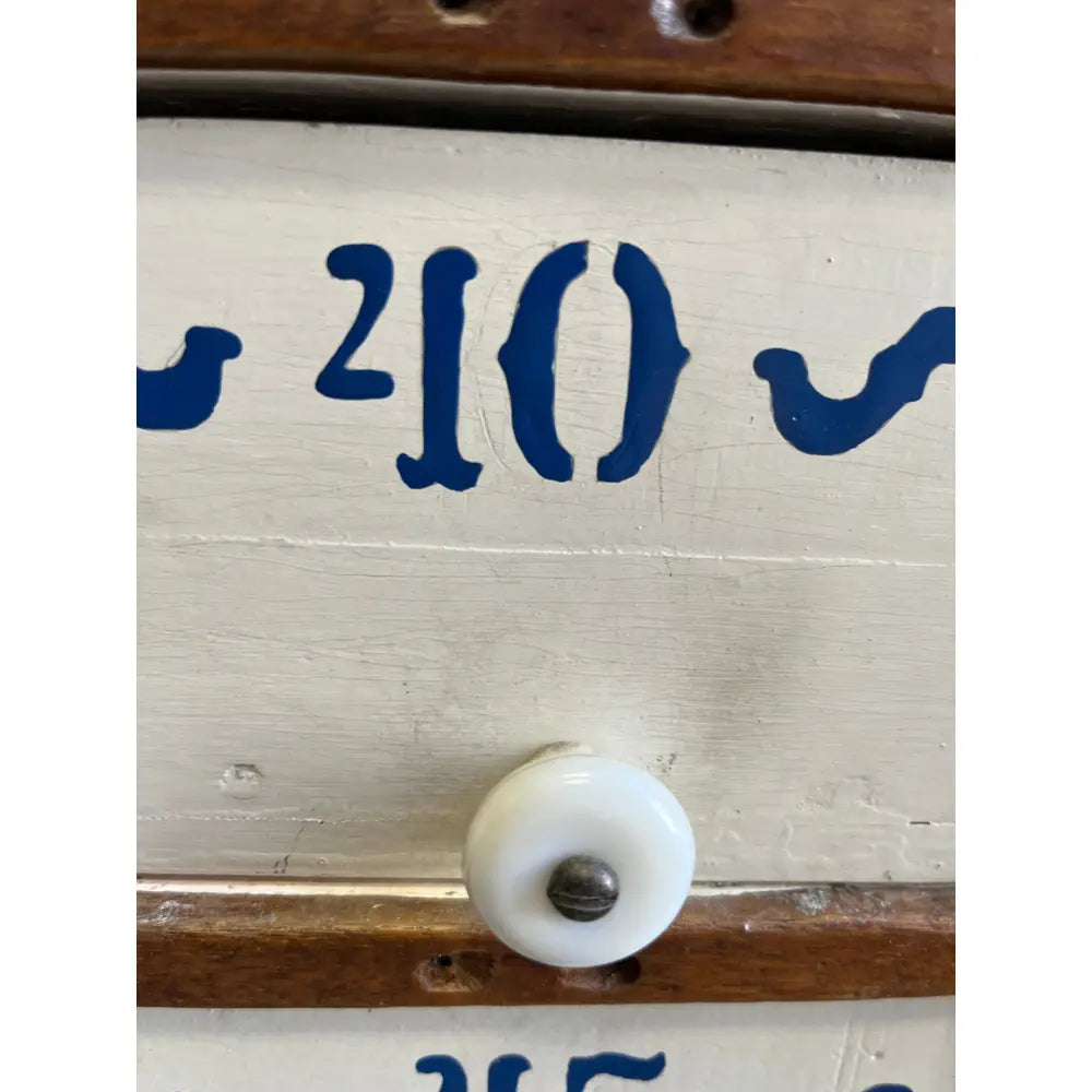 20s-era white plastic knob with blue numbers in Mystery Crystal Box